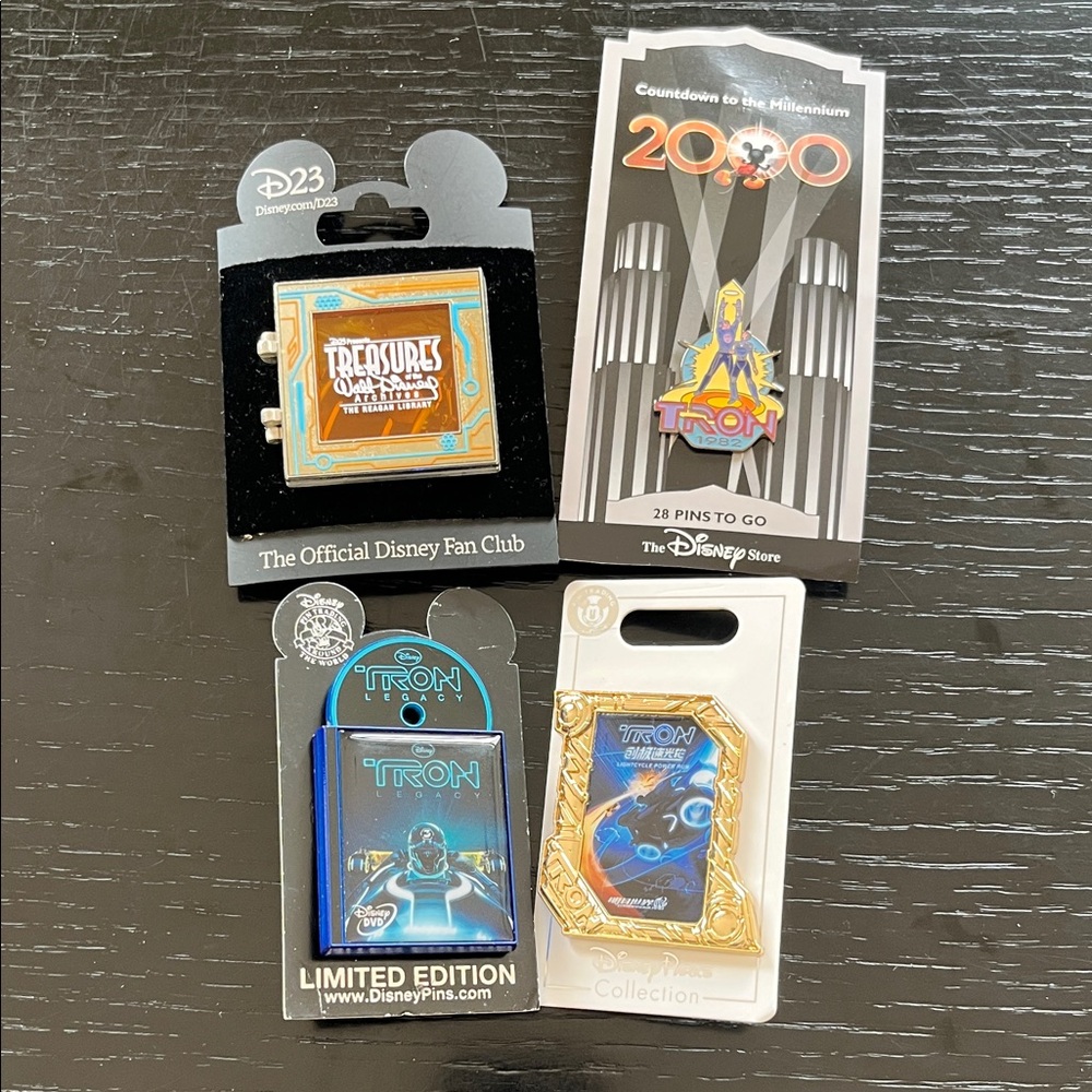Disney TRON 4 Pin Bundle -D23, Shanghai Attraction, DVD Pin and Millennium 2000